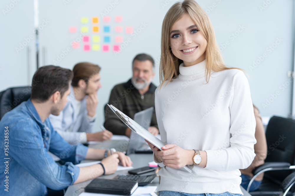 Fototapeta premium Portrait modern business woman in the office with copy space. Female executive wearing casual standing in modern meeting room
