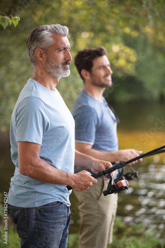 two fishermen preparing for fishing photo