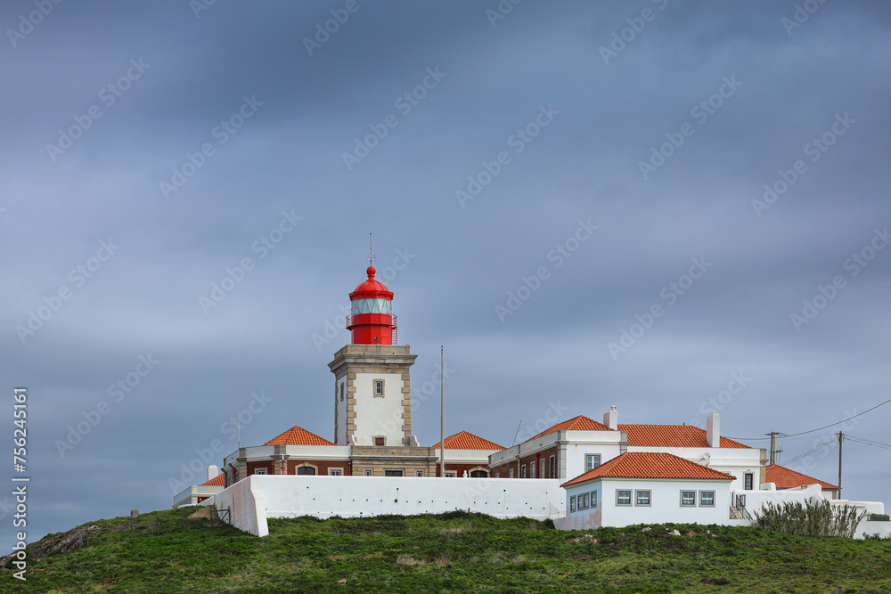 Cabo da Roca lighthouse on the cliffs from Atlantic Ocean, the most western point of Europe. Travel to this landmark from Portugal. Cabo da Roca landscape.