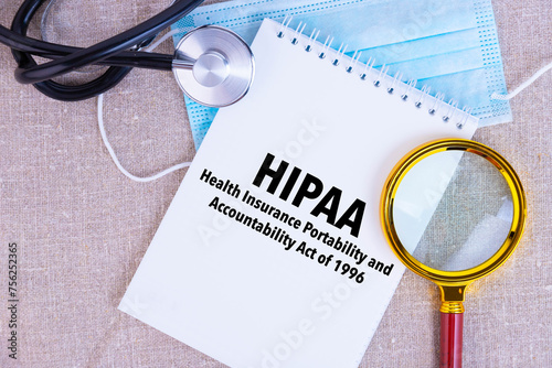 Принти на полотні HIPAA, the Health Insurance Portability and Accountability Act of 1996, text written on white notepad, medical mask, stethoscope, magnifying glass on linen background