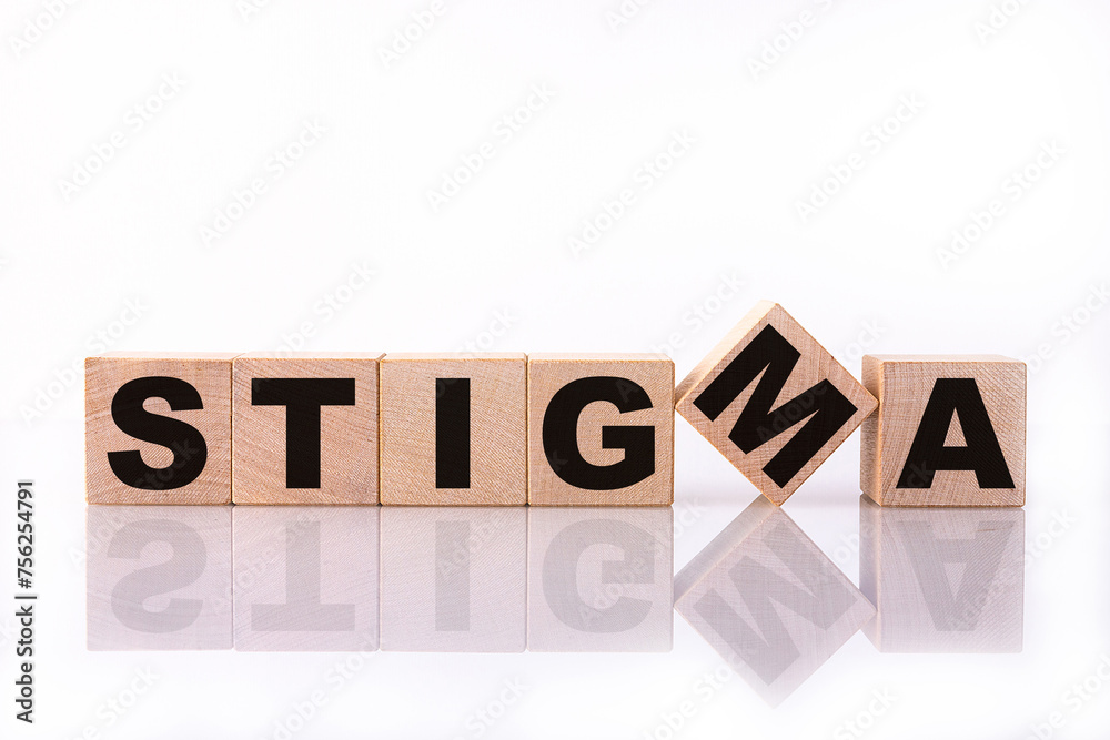 STIGMA word, text, written on wooden cubes, building blocks, over white background with reflection. STIGMA word, text, written on wooden cubes, building blocks, over white background with reflection.