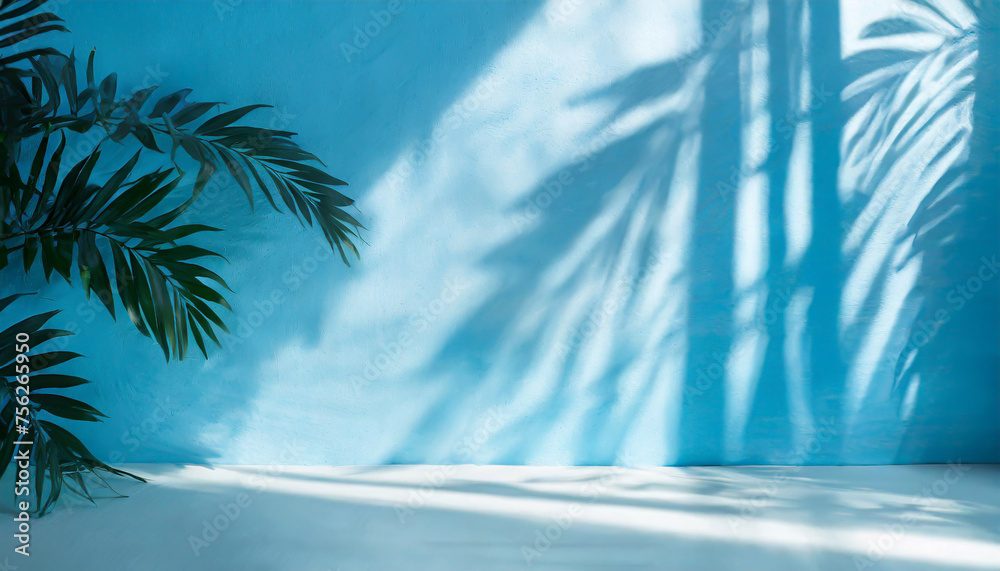 Blurred shadow from palm leaves on the light blue wall. Minimal abstract background for product presentation. Spring and summer. Blurred shadow from palm leaves on the light blue wall. Minimal abstract background for product presentation. Spring and summer.