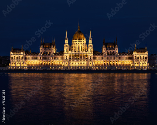 Stunning night view of the illuminated Hungarian Parliament Building. © Wirestock