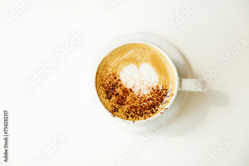 Cup of coffee with heart pattern.