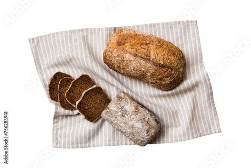 Freshly baked bread slices on napkin against isolated on white background. top view Sliced bread
