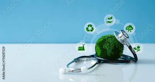 Earth Day - Environment Concept.Green Earth and a stethoscope with Saving the environment and environmentally sustainable icon. Global healthcare. ESG, Net zero, co2. photo