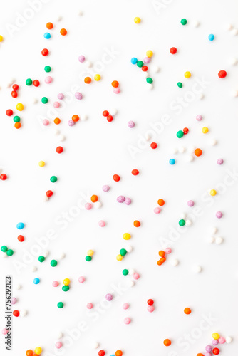 Colorful confectionery sprinkles on white background. Decoration for cake and bakery.