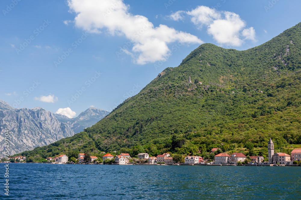 The village of Donji Stoliv on the coast of Boka Kotorska (the Bay of Kotor), Montenegro, with the abandoned village of Gornji Stoliv high above