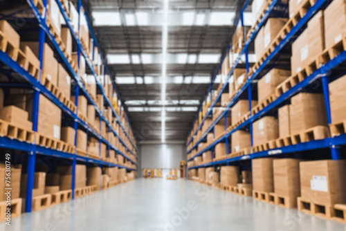 Warehouse interior background. Background out of focus photo of the large modern storehouse with some goods. © AlexGo