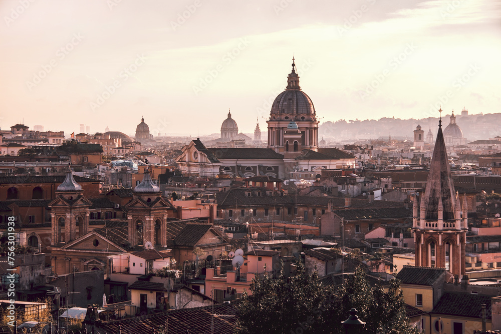 Rome panoramic view. A glowing sunset bathes the historic skyline of Rome in warm light, showcasing the city's iconic architecture and domed cathedrals. Rome, Italy