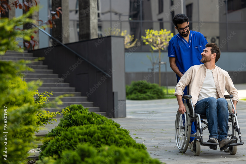 Male nurse rolling a wheelchair with patient and both feeling good