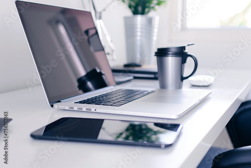 Elegant workspace with laptop and smartphone