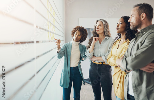 Group of diverse businesspeople talking during an office brainstorming session photo