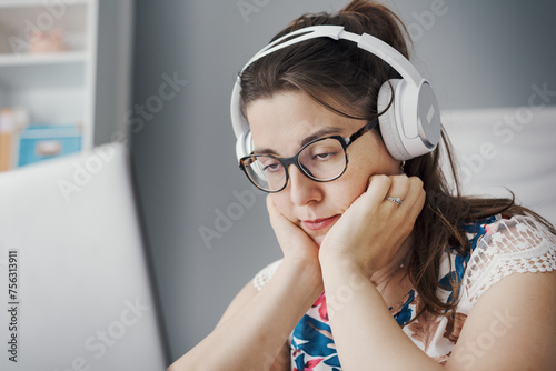 Bored woman watching videos online