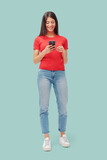 Happy young woman using a smartphone