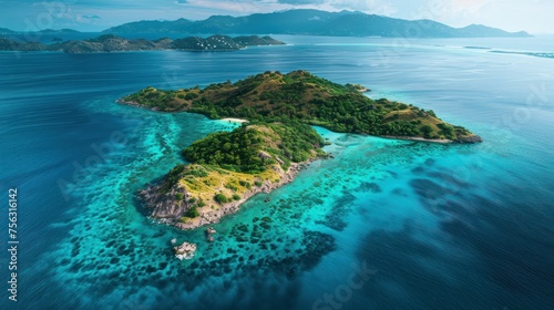 From above, a secluded tropical island is framed by crystal clear waters, an aerial snapshot highlighting its serene natural beauty.