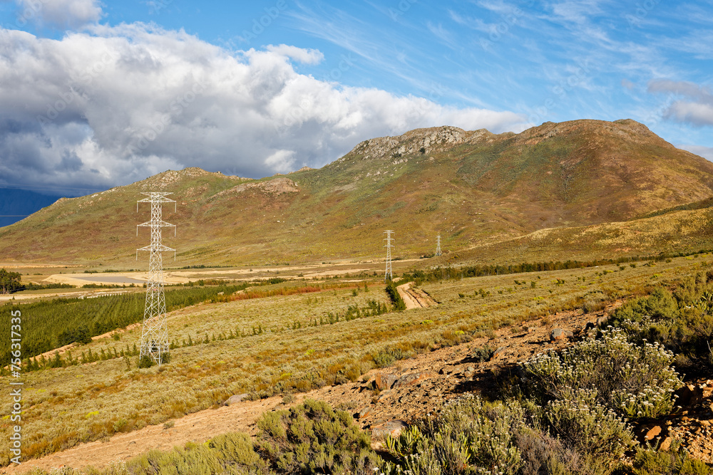 High voltage electrical pylons on farmland near Worcester, Western Cape, South Africa.