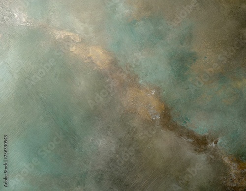 An image focusing on bronze with a greenish patina, offering a look at the natural oxidation process and its effect on the metal's appearance.