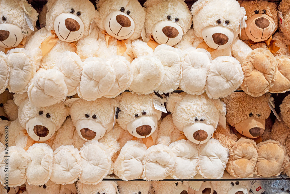 soft toy white and brown teddy bears on the counter in a children's store soft toy white and brown teddy bears on the counter in a children's store