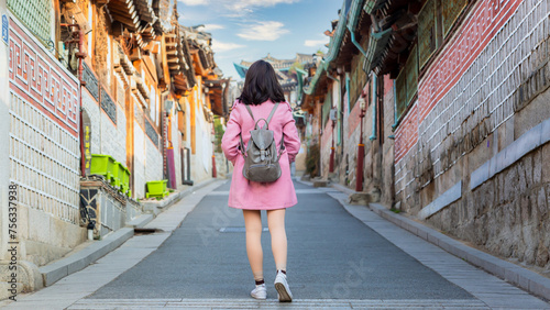 Asian traveler travel at traditional Korean style architecture at Bukchon Hanok Village in Seoul, South Korea, Bukchon Hanok Village in Seoul, South Korea. photo