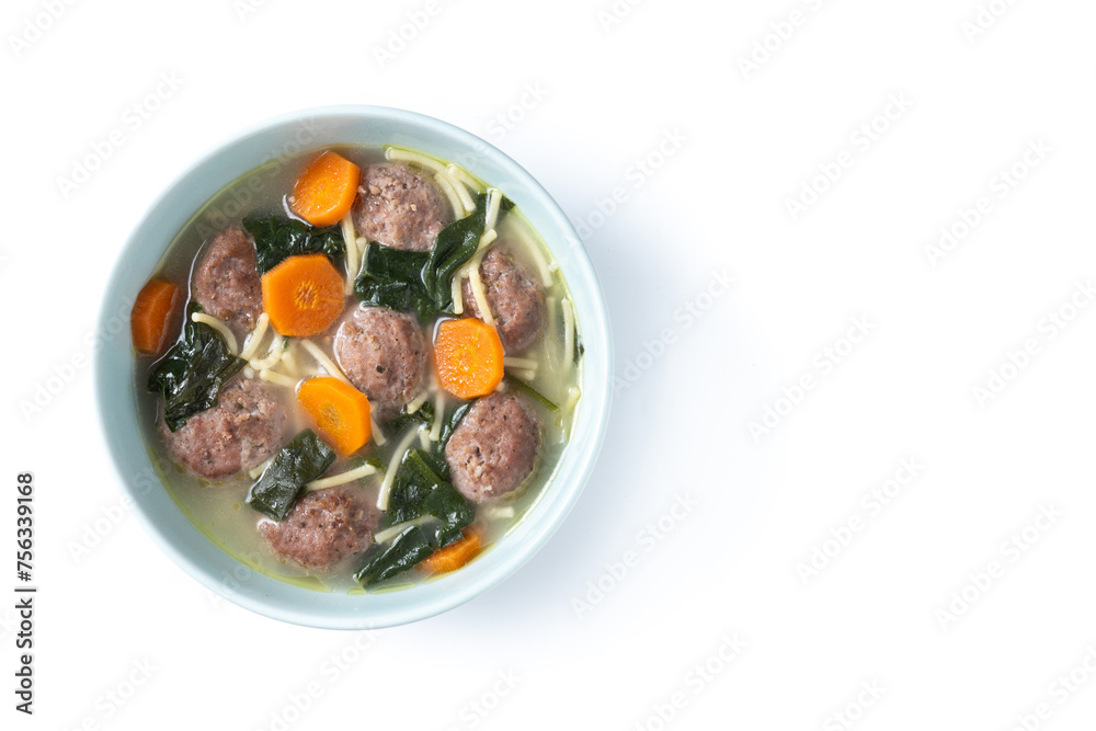 Italian Wedding Soup with meatballs and spinach isolated on white background. Top view. Copy space