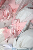 Three wedding bouquets in pink and white wrapping paper and other colours. Close-up