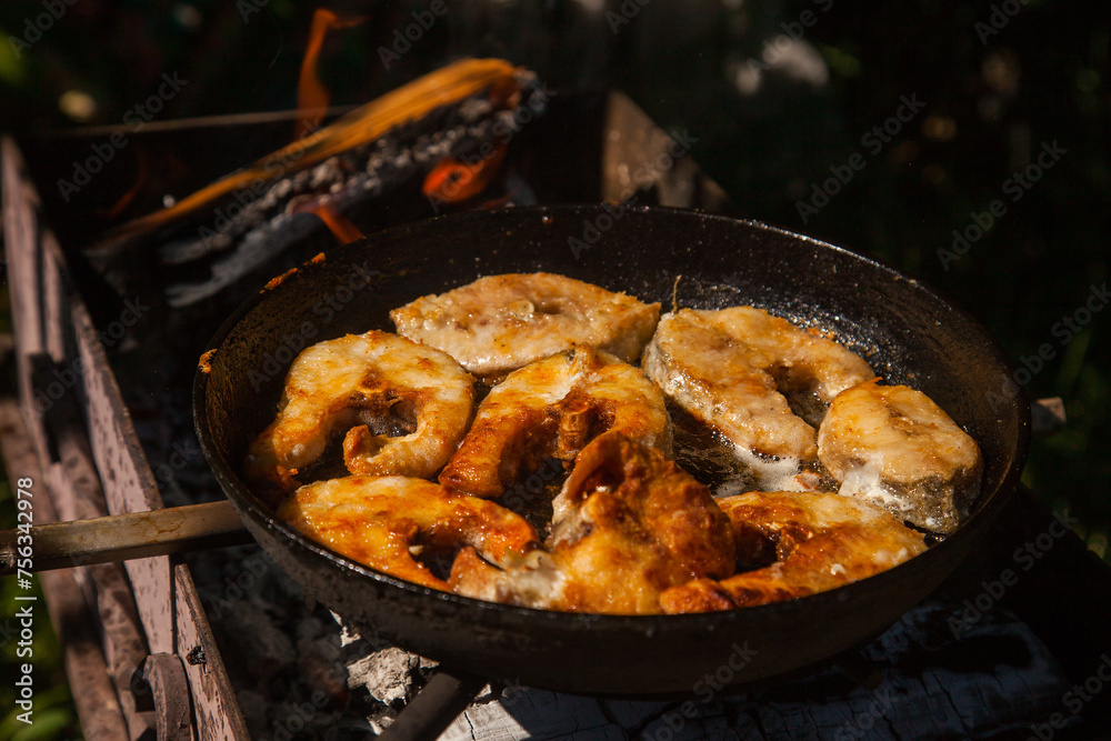 Pan frying or home cooking fish on the fire. Pan frying or home cooking fish on the fire.
