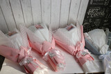 Wedding bouquets in pink and white wrapping paper.