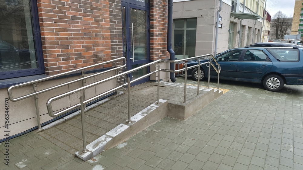 Poster To enable people with disabilities to enter the building, a ...