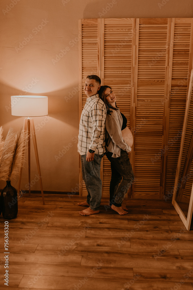 Fototapeta premium an incredibly beautiful married couple Expecting child, pregnant wife.