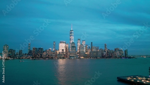 US City. Manhattan at night city lights. Night in Manhattan, NYC aerial view. New York City, Illuminated Manhattan view from drone. NYC, Manhattan skyline. Night city scene NY, USA.