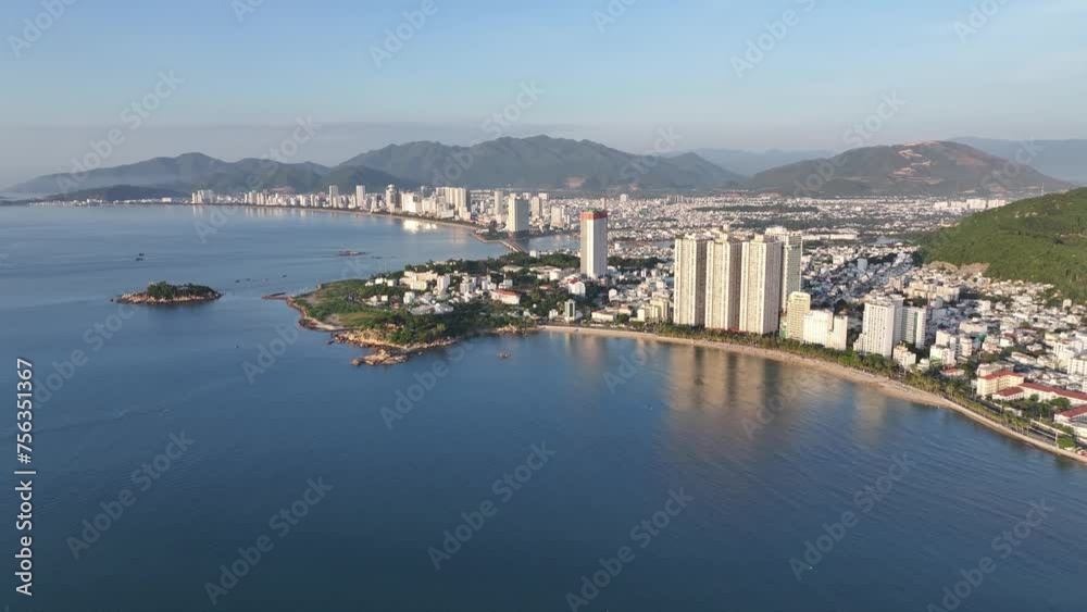 Aerial video of the beautiful coastal city of Nha Trang, with high-rise buildings and cultural buildings. Famous tourist destination of Vietnam