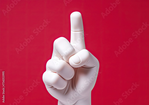 Hand Making Peace Sign on Red Background photo