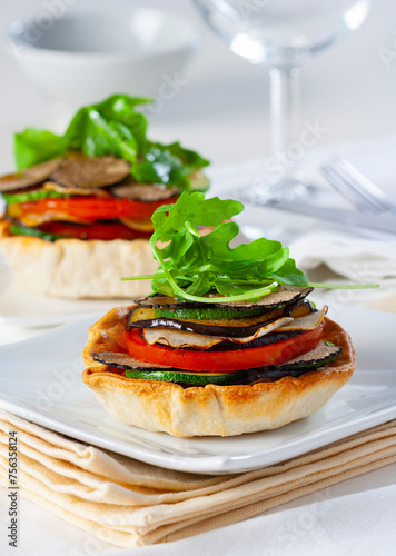 Grilled vegetable tartlet with arugula and black truffle...