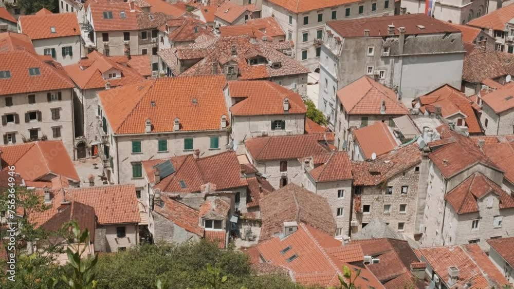 Aerial view of Kotor old town with orange rooftops in Kotor bay, Montenegro. Medieval architecture. Summer vacation resort on Adriatic fjord in summer day. Travel destination Aerial view of Kotor old town with orange rooftops in Kotor bay, Montenegro. Medieval architecture. Summer vacation resort on Adriatic fjord in summer day. Travel destination