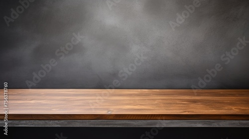 An empty brown wooden countertop against a dark gray concrete grunge wall. Horizontal Banner, Luxury Template, Layout, showcase, platform for demonstration, Presentation of goods.