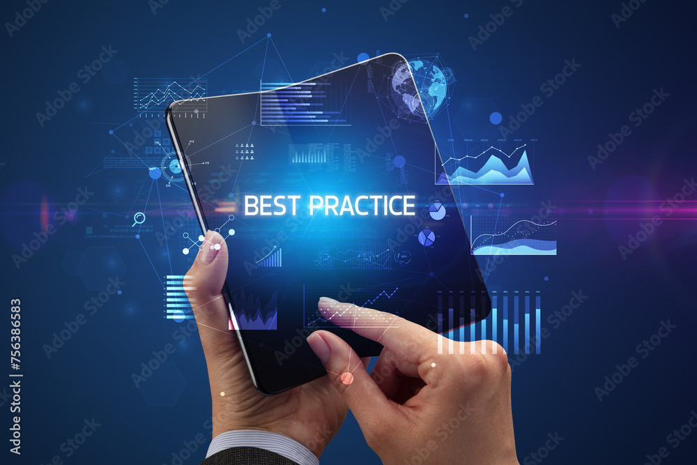 Businessman holding a foldable smartphone, business concept Businessman holding a foldable smartphone, business concept