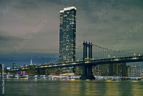 Manhattan Bridge, suspension bridge that crosses East River in New York City, connecting Lower Manhattan with Downtown Brooklyn. Evening