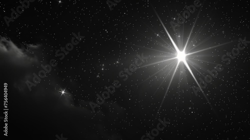 A timeless black and white photograph showcasing a luminous star set against a deep, dark backdrop.