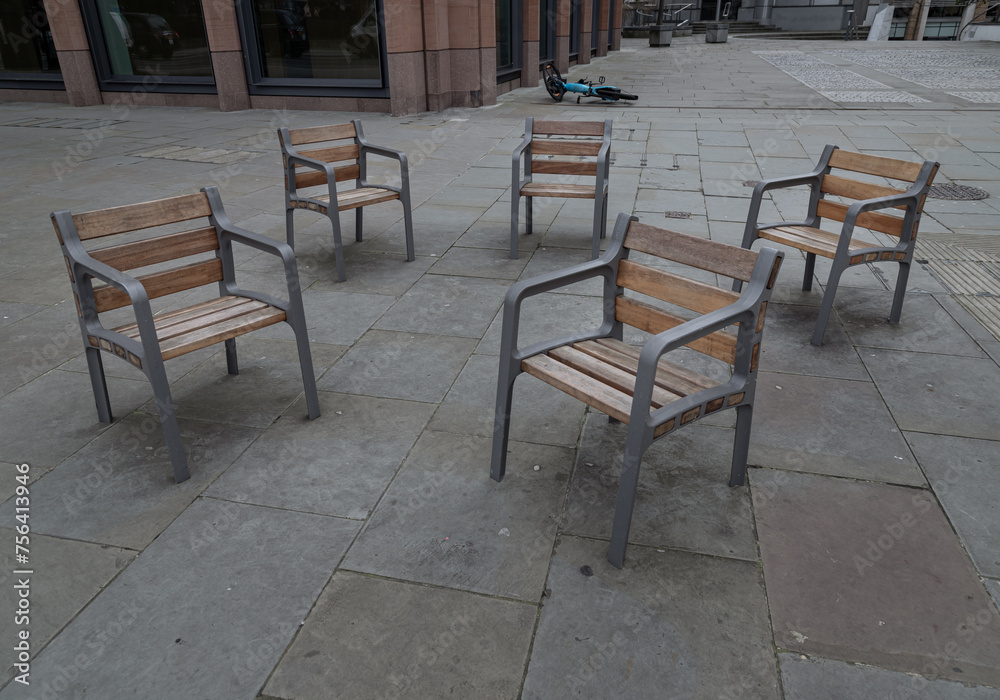 These street chairs look casually placed, but they're screwed into the floor for People can comfortably sit together. Contemporary chairs, Furniture group, Space for text, 