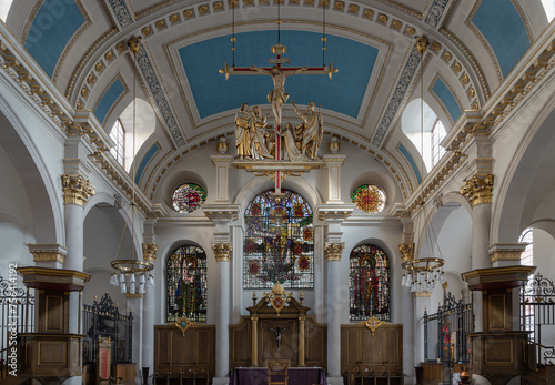 Interior view St Mary le Bow Church and The modern hanging sculptural of Crucifixion in church St.Mary le Bow (Sir Christopher Wren). Space for text, Selective focus. photo