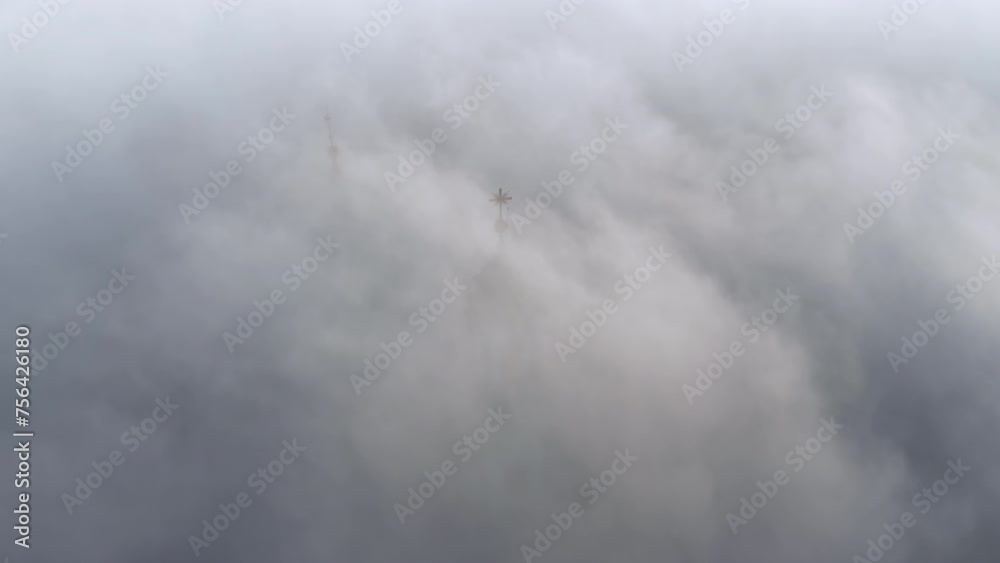 Dense fog over Wawel Castle in Krakow, Poland with slightly visible tower Dense fog over Wawel Castle in Krakow, Poland with slightly visible tower