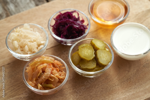 Fermented foods and vegetables - kimchi, purple and white sauerkraut, apple cider vinegar, gherkins and kefir