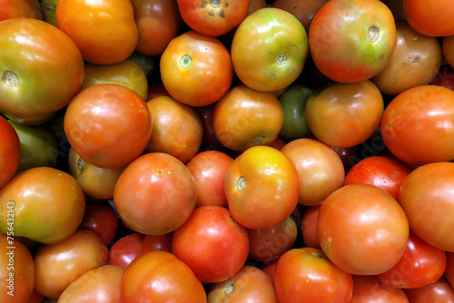 Directly above view a stack of ripe tomatoes