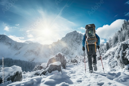 Hiker with backpack hiking in winter mountains. Travel and adventure concept. Hiking in solitude. Climbing the mountain through the snow.