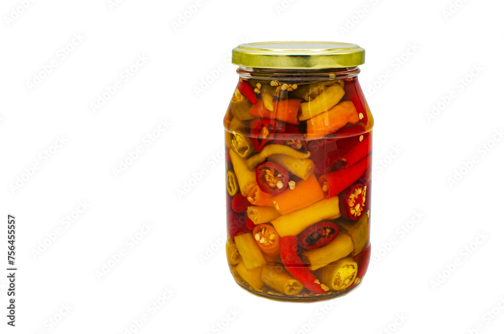 Hot pepper in a glass jar on an isolated background Hot pepper in a glass jar on an isolated background