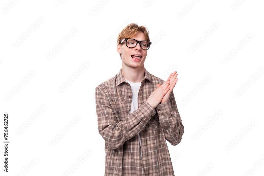 young caucasian man with red hair wears glasses and a shirt young caucasian man with red hair wears glasses and a shirt