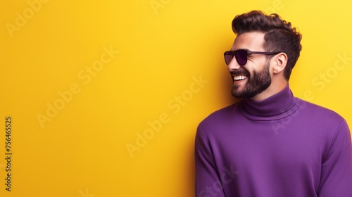 Smiling Man in Purple Turtleneck Against Yellow Background