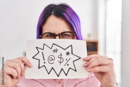 Young beautiful plus size woman business worker holding onomatopeia banner shouting at office