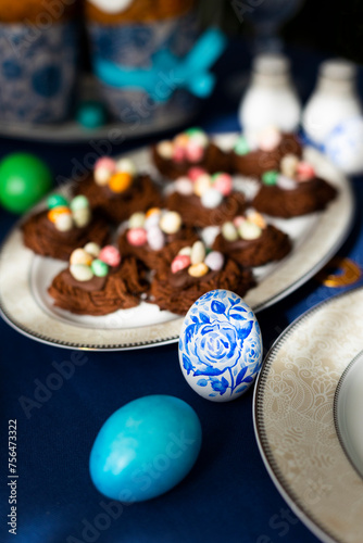 Holiday Easter homemade cookies in shape of nests with colorful sugar eggs